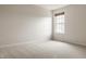 Bright, carpeted bedroom featuring neutral walls and a window with natural light at 3419 Burlingame Blvd, Carmel, IN 46074