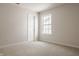 Bright unfurnished bedroom featuring neutral carpet, light walls, and a sunlit window at 3419 Burlingame Blvd, Carmel, IN 46074