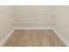 Walk-in closet featuring vinyl floors and wire shelving for ample storage space at 3419 Burlingame Blvd, Carmel, IN 46074