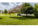 Community green space featuring lush grass, pond with fountain, and walking paths at 3419 Burlingame Blvd, Carmel, IN 46074