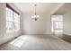 Elegant dining area with a chandelier and large window at 3419 Burlingame Blvd, Carmel, IN 46074