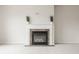 Close-up of fireplace featuring a white mantel and stone surround at 3419 Burlingame Blvd, Carmel, IN 46074