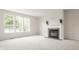 Living room featuring a fireplace and a large window at 3419 Burlingame Blvd, Carmel, IN 46074
