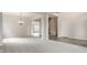 Open-concept living space showcasing carpeted flooring, wood-look flooring, and stairs at 3419 Burlingame Blvd, Carmel, IN 46074