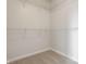 Unfurnished walk-in closet features wire rack shelving and neutral carpeting at 3419 Burlingame Blvd, Carmel, IN 46074