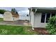 Backyard with shed, white fencing, patio and green grass at 3702 Candy Cane Dr, Indianapolis, IN 46227