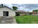 Large backyard with mature trees and well-maintained lawn, perfect for outdoor activities at 3702 Candy Cane Dr, Indianapolis, IN 46227
