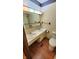 Bathroom with a double sink vanity, wood trim, and a large mirror at 3702 Candy Cane Dr, Indianapolis, IN 46227
