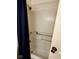 Standard white bathtub with blue curtain and safety bars for accessibility at 3702 Candy Cane Dr, Indianapolis, IN 46227