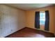 Comfortable bedroom with wallpaper, wood flooring, and natural light at 3702 Candy Cane Dr, Indianapolis, IN 46227