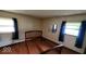 Bedroom featuring hardwood floors and two windows at 3702 Candy Cane Dr, Indianapolis, IN 46227