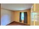 A secondary bedroom provides a calming retreat with soft lighting, neutral colors, and pleasant wallpaper at 3702 Candy Cane Dr, Indianapolis, IN 46227