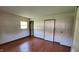 Bedroom with wood floor, and multiple windows allowing for plenty of natural light at 3702 Candy Cane Dr, Indianapolis, IN 46227