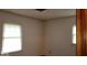 Well-lit bedroom featuring neutral walls and two bright, inviting windows at 3702 Candy Cane Dr, Indianapolis, IN 46227