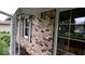Charming exterior showcasing brick facade, black shutters, and well-maintained landscaping at 3702 Candy Cane Dr, Indianapolis, IN 46227