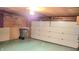 A clean, expansive garage with ample space, featuring a white door and storage solutions at 3702 Candy Cane Dr, Indianapolis, IN 46227