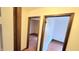 Hallway displaying two doorways leading into rooms with neutral color schemes and coordinated floorings at 3702 Candy Cane Dr, Indianapolis, IN 46227
