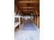 Interior space with wood paneling and exposed beams, offering potential for customization at 3702 Candy Cane Dr, Indianapolis, IN 46227