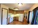 Traditional kitchen featuring wood cabinets, white appliances, and a window letting in natural light at 3702 Candy Cane Dr, Indianapolis, IN 46227