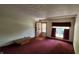 Cozy living room featuring a window, textured ceiling, and a classic entry door at 3702 Candy Cane Dr, Indianapolis, IN 46227