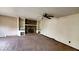 Open living room with brick fireplace, built-in bookshelves, and neutral paint at 3702 Candy Cane Dr, Indianapolis, IN 46227