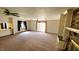 An open living room features a brick fireplace, built-in shelving, and a view to an adjacent dining area at 3702 Candy Cane Dr, Indianapolis, IN 46227