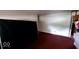 Living room features a red carpet and an open doorway, ready for furnishing at 3702 Candy Cane Dr, Indianapolis, IN 46227