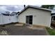 Concrete patio area with sliding glass door access and white fence at 3702 Candy Cane Dr, Indianapolis, IN 46227