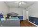Delightful bedroom featuring a whimsical bed frame and chair rail at 376 S Arlington Ave, Indianapolis, IN 46219