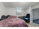 Cozy bedroom featuring a comfortable bed, work desk, and a chair; perfect for rest and productivity at 376 S Arlington Ave, Indianapolis, IN 46219