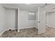 Clean bedroom with laminate flooring, a window, and a closet space; perfect for relaxation and storage at 376 S Arlington Ave, Indianapolis, IN 46219