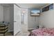 Bedroom featuring hardwood floors and a TV for relaxing and entertaining at 376 S Arlington Ave, Indianapolis, IN 46219