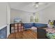 Charming bedroom featuring hardwood floors, a TV, and a playful color scheme at 376 S Arlington Ave, Indianapolis, IN 46219