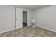 View of the room, featuring laminate flooring and fresh paint, offering an appealing and comfortable space at 376 S Arlington Ave, Indianapolis, IN 46219