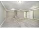The finished basement has neutral carpeting, paint, and trim. There is also storage and stair access at 3852 Knollton Rd # 3852, Indianapolis, IN 46228