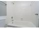Bright bathroom with a white tiled shower/tub combination and a toilet at 3852 Knollton Rd # 3852, Indianapolis, IN 46228