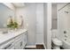 Bathroom features a vanity sink with a large mirror, white cabinets, and combination shower with tub at 3852 Knollton Rd # 3852, Indianapolis, IN 46228