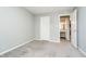 The bright bedroom has a bathroom just off the room as well as plush carpeting at 3852 Knollton Rd # 3852, Indianapolis, IN 46228