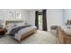 Bright bedroom featuring a wood bed frame, neutral walls, and a large window with decorative curtains at 3852 Knollton Rd # 3852, Indianapolis, IN 46228