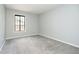 The neutral painted bedroom has plush carpeting and a window to let in natural light at 3852 Knollton Rd # 3852, Indianapolis, IN 46228
