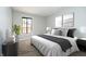 Cozy bedroom featuring a queen bed, large window and soft decor for a relaxing atmosphere at 3852 Knollton Rd # 3852, Indianapolis, IN 46228