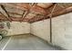Spacious garage with exposed wood beams, room for vehicles, and bicycle storage at 3852 Knollton Rd # 3852, Indianapolis, IN 46228