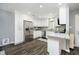 Bright kitchen with white cabinets, stainless steel appliances, granite countertops and modern fixtures at 3852 Knollton Rd # 3852, Indianapolis, IN 46228