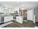 Modern kitchen featuring white cabinets, stainless steel appliances, and a breakfast bar at 3852 Knollton Rd # 3852, Indianapolis, IN 46228