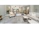 Open concept living room adjacent to dining area with neutral walls and modern furnishings at 3852 Knollton Rd # 3852, Indianapolis, IN 46228