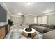 Spacious living room area with comfortable seating, decorative rug, and modern entertainment center at 3852 Knollton Rd # 3852, Indianapolis, IN 46228