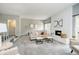 Spacious living room featuring a fireplace, neutral tones, and access to the stairway at 3852 Knollton Rd # 3852, Indianapolis, IN 46228