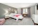 Bedroom with a cozy bed, desk, and a soft color palette create a calm and inviting space at 3852 Knollton Rd # 3852, Indianapolis, IN 46228