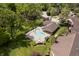 Aerial view of community pool with lounge chairs, surrounded by lush landscaping and trees at 3852 Knollton Rd # 3852, Indianapolis, IN 46228