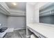 Spacious walk-in closet with ample shelving, storage, and a makeup vanity area at 3852 Knollton Rd # 3852, Indianapolis, IN 46228